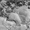 Girron, oblique aerial view, taken from the NNE, centred on cultivation terraces and small cairns.