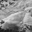 Girron, oblique aerial view, taken from the SSE, showing cultivation terraces and small cairns.