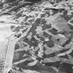 Glen Fender, oblique aerial view, taken from the NE, centred on a hut-circle. The Crieff to Dalnacardoch militray road is visible in the left half of the photograph.