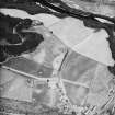 Logierait, oblique aerial view taken from the SW, centred on the cropmarks of a souterrain, roundhouses, pits and a fort.  There are also numerous linear cropmarks showing in the photograph.