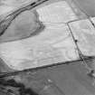 Oblique aerial view centred on the cropmarks of the Roman Temporary Camp, rig and palaeochanels, taken from the SSE.