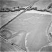 Forteviot, oblique aerial view, taken from the NNE, centred on the cropmarks of the SW corner of the Roman Temporary Camp and on rig.