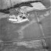 Leadketty, oblique aerial view, taken from the SE, centred on cropmarks of a possible henge, ring-ditches and pits.