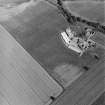 Leadketty, oblique aerial view, taken from the WNW, centred on the cropmarks of a possible henge, pits and ring-ditch.