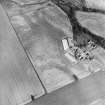 Oblique aerial view of Leadketty centred on the cropmarks of a possible henge, ring ditches and pits, taken from the W.
