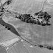 Inverdunning House, oblique aerial view, taken from the SSE, centred on the cropmarks including those of pits. Cropmarks of an enclosure are visible in the bottom half of the photograph, and Inverdunning House is visible in the top half.