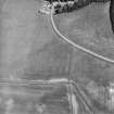 Oblique aerial view centred on the cropmarks of the pits, rig and enclosure with house adjacent, taken from the SW.