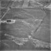 Muirhead, Myretown Wood and Drum of Garvock, oblique aerial view, taken from the NW, centred on the cropmarks of two enclosures and linear cropmarks. Two possible possible enclosures are visible in the top centre half of the photograph.
