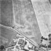 Forteviot, oblique aerial view, taken from the NNW, centred on cropmarks including those of an enclosure, a barrow cemetery and pit-alignments. Farm of Forteviot is visible in the bottom left-hand corner of the photograph.