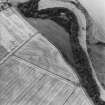 Oblique aerial view of Henhill centred on cropmarks, taken from the SSW.