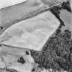 Dun Knock, Dunning, oblique aerial view, taken from the SW, centred on the cropmarks of the fort.
