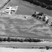 Oblique aerial view centred on linear cropmarks, taken from the ENE.