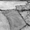 Oblique aerial view of Luncarty centred on the cropmarks of a settlement, enclosure, and cultivation remains, also visible are linear cropmarks, taken from the E.