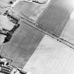 Huntingtower, oblique aerial view, taken from the NNW, centred on the cropmarks of a henge.