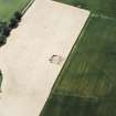 Oblique aerial view centred on the excavation of the Roman watch tower, taken from the NNW.