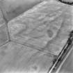 Oblique aerial view of loak centred on the cropmarks of a pit-alignment, taken from the ESE.