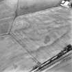 Oblique aerial view of loak centred on the cropmarks of a pit-alignment, taken from the E.