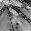 Oblique aerial view centred on the excavations of the Cromwellian fort, taken from the SW.