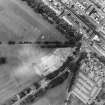 Oblique aerial view centred on the excavations of the Cromwellian fort, taken from the SE.