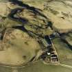 Oblique aerial view centred on the remains of the fermtoun and enclosure with rig and enclosures adjacent, taken from the S.