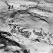 Oblique aerial view centred on the farmstead with farmstead adjacent, taken from the SSW.