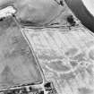 Kercock, oblique aerial view, taken from the E, centred on an area of cropmarks, including those of an enclosure and a ring-ditch.