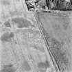 Kercock, oblique aerial view, taken from the W, centred on an area of cropmarks, including those of an enclosure and a ring-ditch.