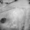 Oblique aerial view of Hallhole centred on the cropmarks of an enclosure, pits, trackways and other cropmarks, takne from the E.