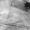 Oblique aerial view centred on the cropmarks of the possible buildings or mortuary enclosures and rig with the pit-alignment adjacent, taken from the WNW.