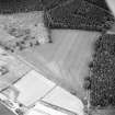 Oblique aerial view centred on linear cropmarks and possible hollow-ways, taken from the NW.