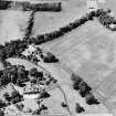 Oblique aerial view centred on the cropmarks of rig and possible timber halls with ice-house, house and country house adjacent, taken from the ENE.