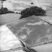 Easter Clunie and Mugdrum, oblique aerial view, taken from the S, centred on the cropmarks of two unenclosed settlements, a souterrain, pits, rig and a possible pit-alignment. An area defined as a cropmark complex is visible in the top half of the photograph.