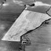 Oblique aerial photograph of Reedieleys centred on cropmarks, including cultivation remains and rig, taken from the W.