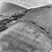Pitroddie, oblique aerial view, taken from the WSW, centred on cropmarks including an unenclosed settlement, souterrains and ring-ditches.