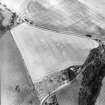 Oblique aerial view centred on the cropmarks of the unenclosed settlements, souterrains and ring-ditches, taken from the W.