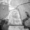 Oblique aerial view centred on the cropmarks of the moated site, taken from the NW.