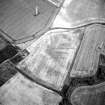 Oblique aerial view centred on the cropmarks of the moated site, taken from the WNW.
