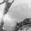 Oblique aerial view centred on the cropmarks of the fort with the bridge adjacent, taken from the SW.