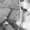 Oblique aerial view centred on the cropmarks of the unenclosed settlement and circular enclosure, taken from the SW.