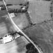 Oblique aerial view centred on the cropmarks of the unenclosed settlement and circular enclosure, taken from the ENE.