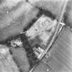 Oblique aerial view centred on the cropmarks of an enclosure and unenclosed settlement.