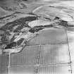 General aerial view of possible quarry remains at Claybrigs, taken from the NW.