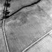 Oblique aerial view centred on the indeterminate cropmarks and tracks, taken from the S.