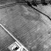 Oblique aerial view centred on the indeterminate cropmarks and tracks, taken from the ESE.