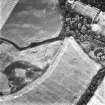 Fowlis Burn, oblique aerial view, taken from the SW, centred on cropmarks of a rectilinear enclosure and linear cropmarks.