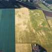 Oblique aerial view centred on the cropmarks of the trackway and rig with the cropmarks of the Roman Temporary Camp adjacent, taken from the SE.