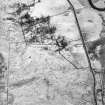 Oblique aerial view centred on the remains of the township and castle, taken from the NW.