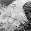 Oblique aerial view of the remains of the township and rig, taken from the NE.