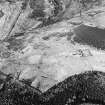 Oblique aerial view of the remains of the township and rig, taken from the NNW.