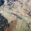 Oblique aerial view of Glen Muick centred on the remains of a township, rig and head-dyke, taken from the SW.